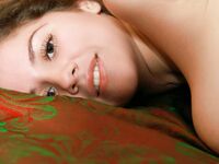 Heavy Chested Brunette Babe Roxi Plays With Her Massive Boobs On The Bed For Cam