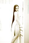 Stretching Across The Bathroom Floor, Deja Chan Lifts Her Legs High Into The Air To Give Intimacy.