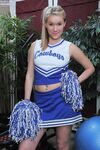 Cheerleader Kristi Kay Takes Off Her Blue Uniform And Displays Her Smooth Pink Pussy