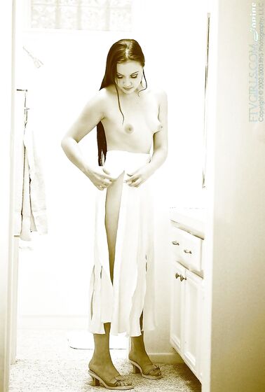 Stretching Across The Bathroom Floor, Deja Chan Lifts Her Legs High Into The Air To Give Intimacy.