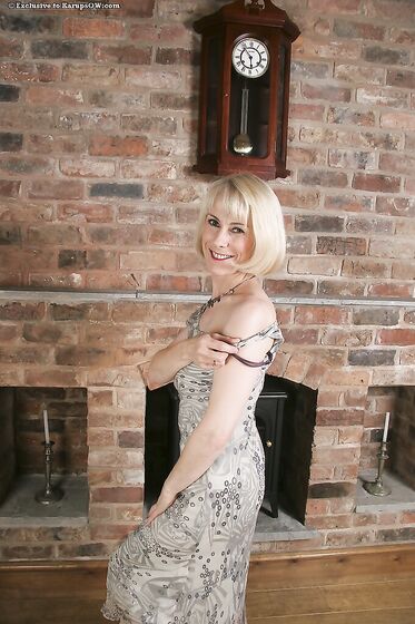 Sexy Bodied Mature Blonde Hazel May Eagerly Exposes Her Bush After Striptease
