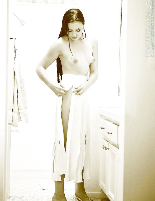 Stretching Across The Bathroom Floor, Deja Chan Lifts Her Legs High Into The Air To Give Intimacy.
